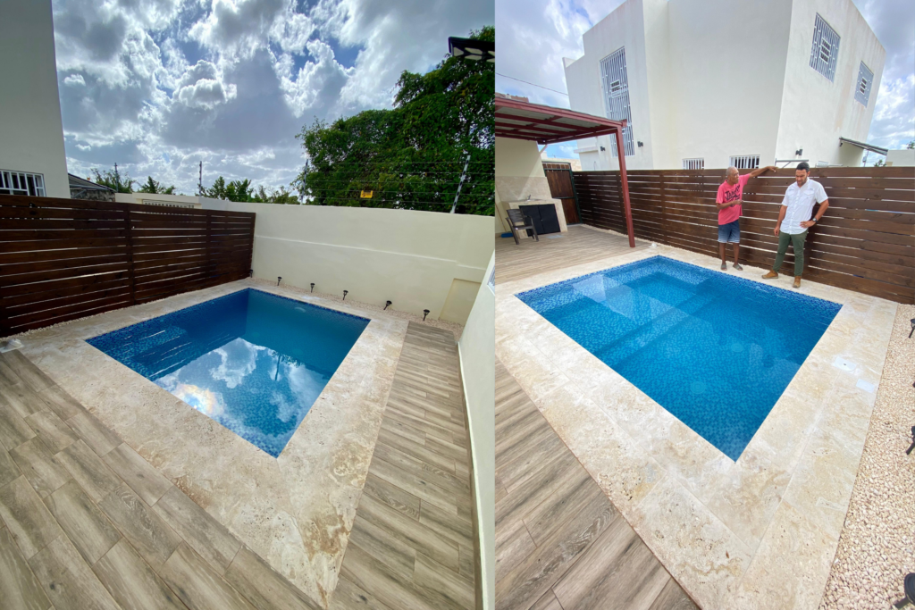 Vistas de la piscina terminada en Ciudad del Sol, con terraza perimetral y cerramiento de madera.